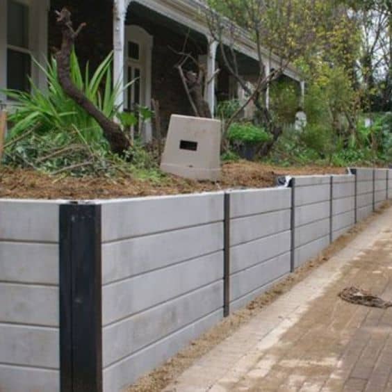 Plain but ultimately functional concrete sleeper retaining walls in Bribsane